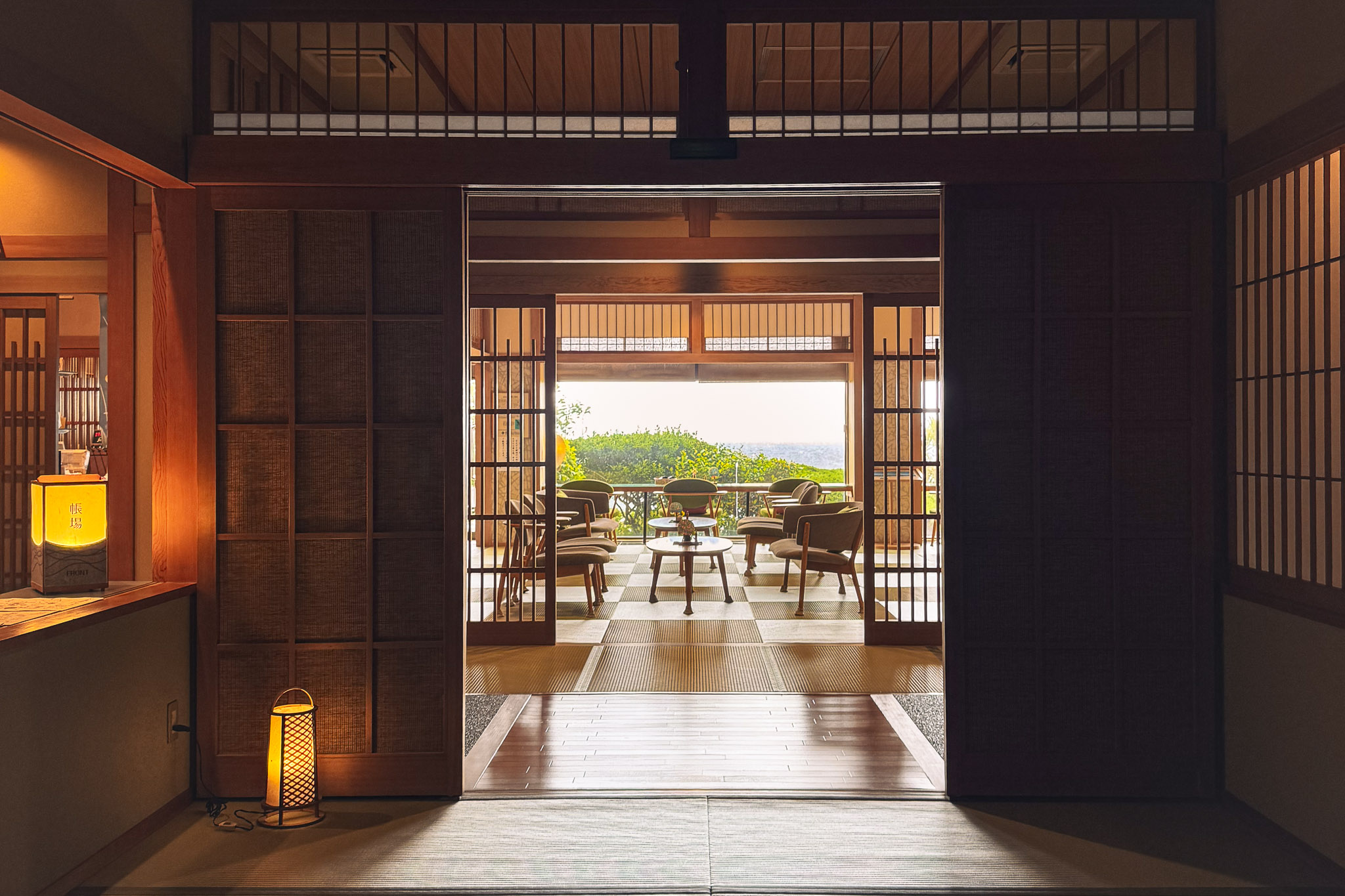 Traditional Japanese entrance at Hotel Sunosaki Kazenosho opening onto an ocean-view lounge in Tateyama, Chiba